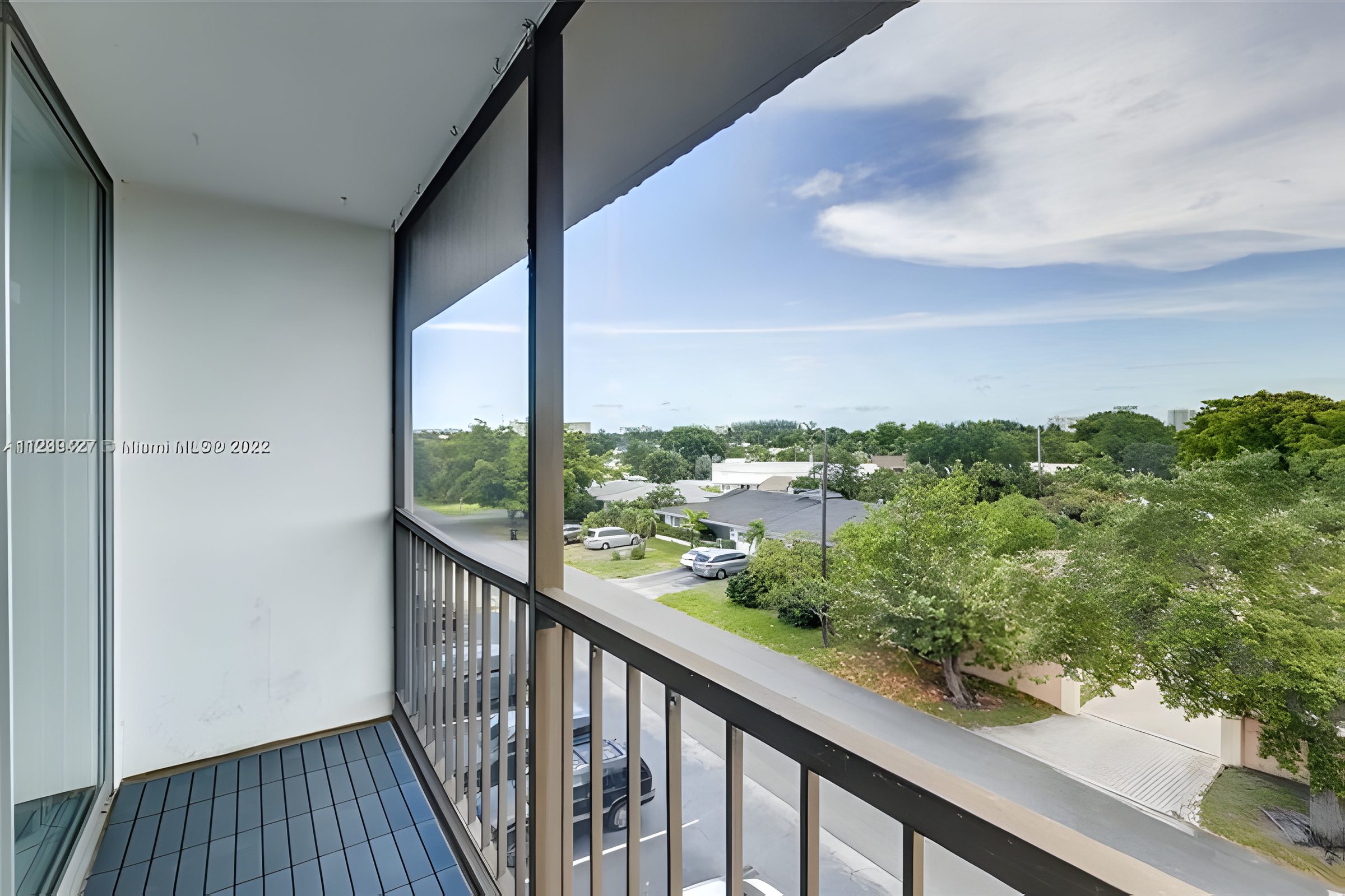 Looking out from a walkway over the trees and rooftops of Coral Ridge.